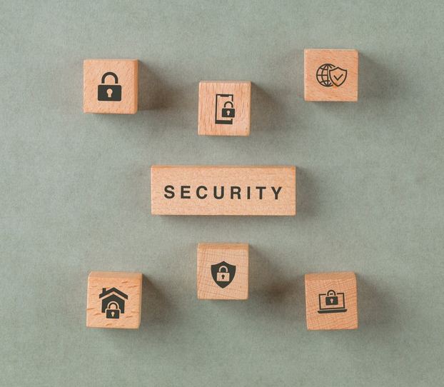 An image of wooden blogs citing ‘security’ and icons