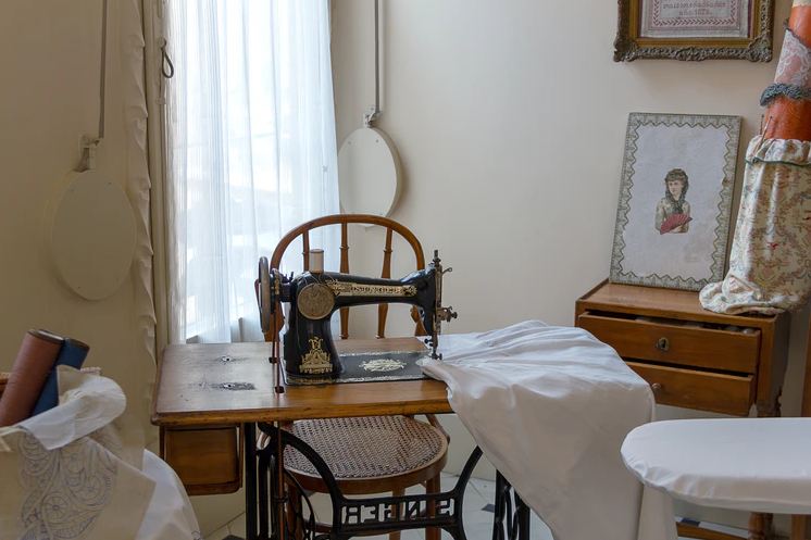 An Image of Black Treadle Sewing Machine.
