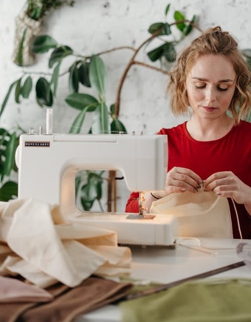 Woman sewing a fabric