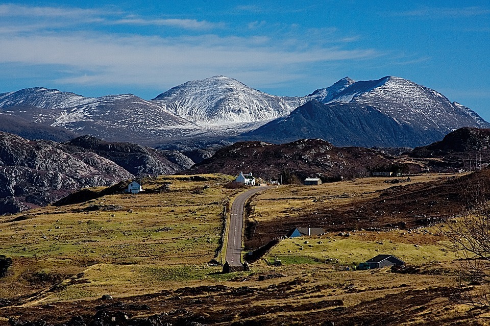 a group of houses at the mountains