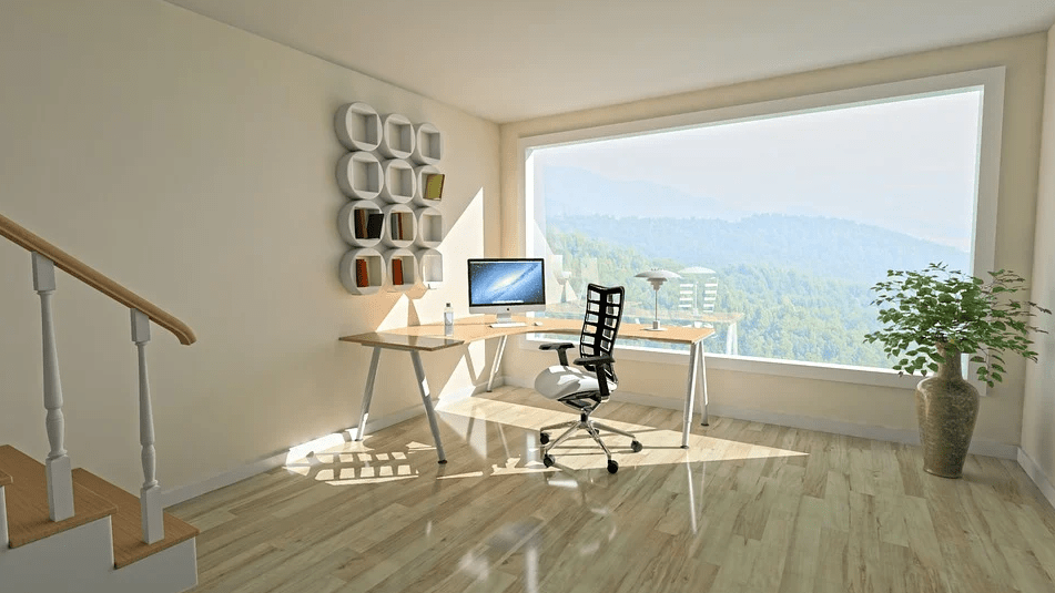 a room with a wide window and light-colored floor