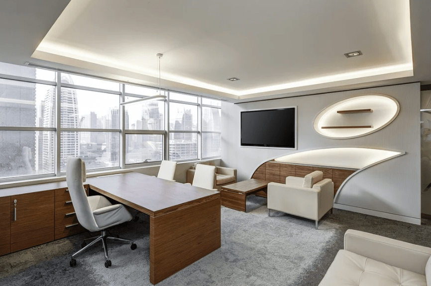 a spacious and cozy business room, with ergonomic chairs, and other furniture