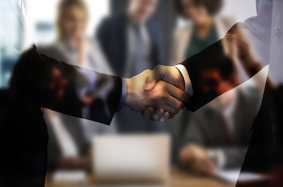 two men shaking hands