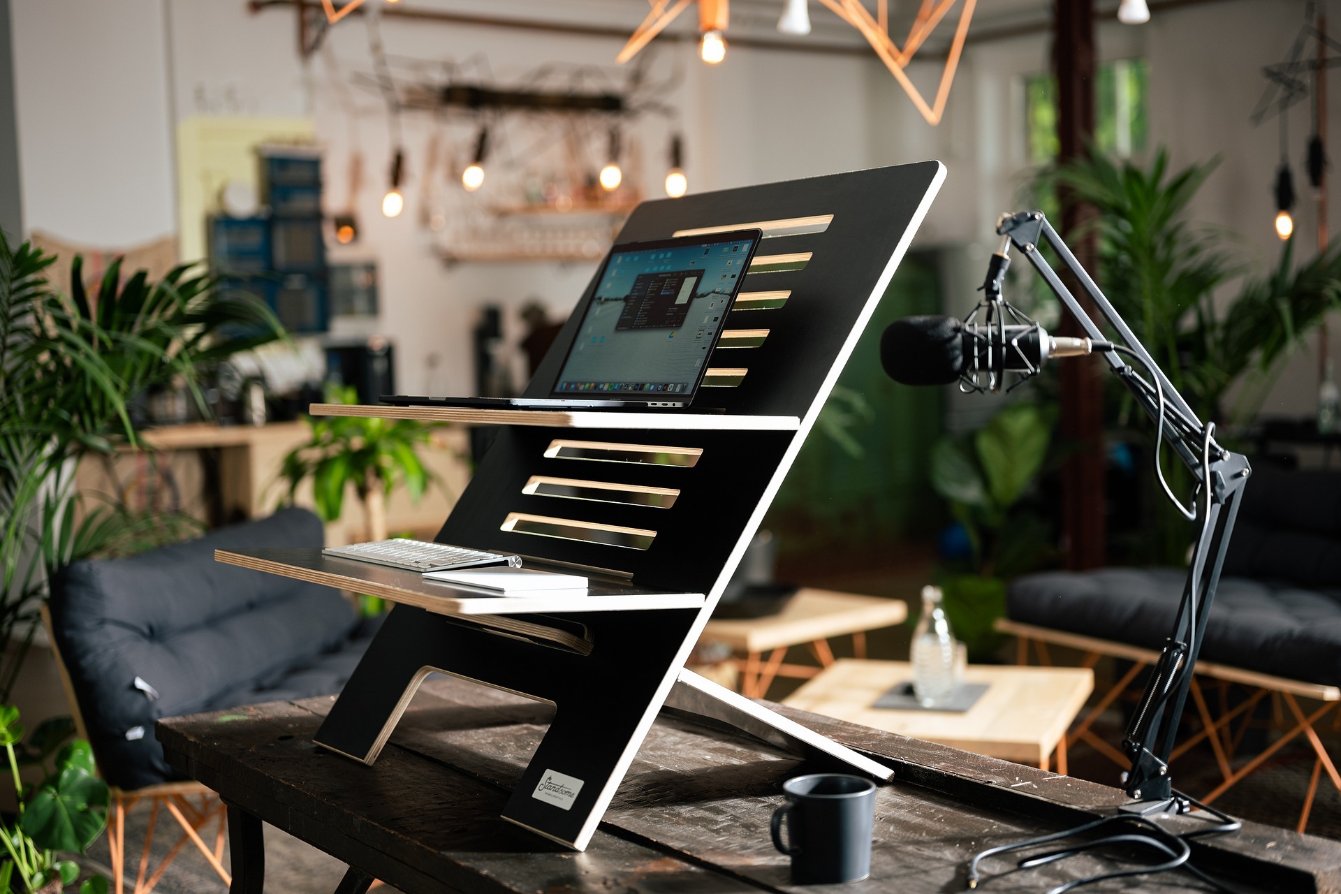 desk set-up with laptop and microphone