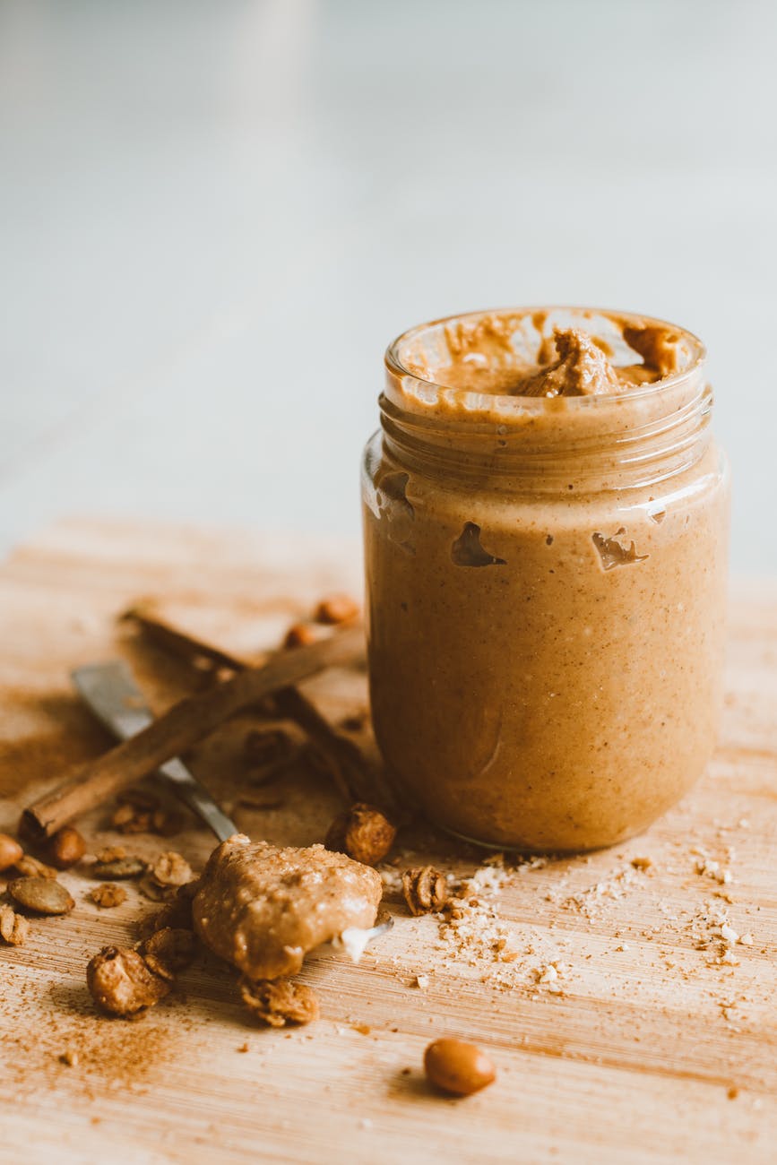 clear glass jar with peanut butter