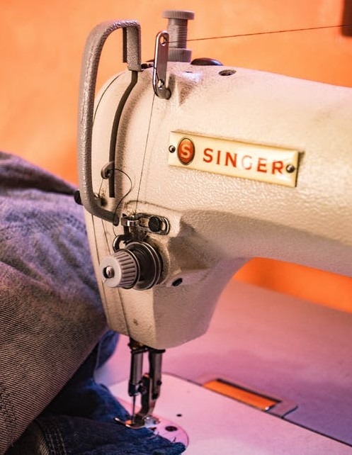An image displaying a white Singer sewing machine