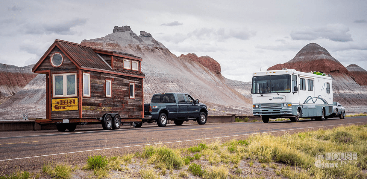 Tiny House Giant Journey travels through the Petrified Forest National Park in Arizona while an RV drives by.