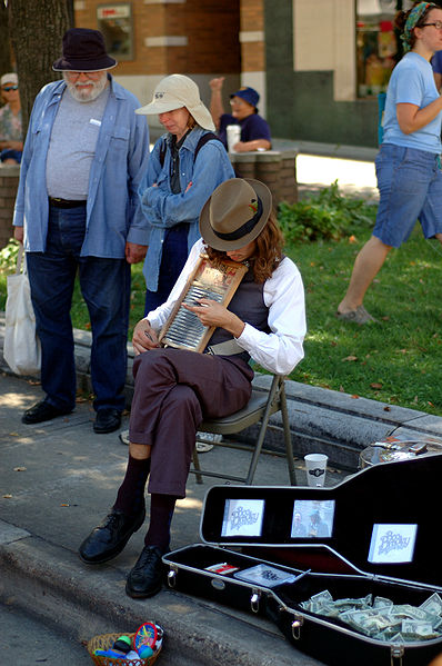 Bradley S. (Of Boo Bradley, Madison WI Busking on a washboard with listeners surrounding him