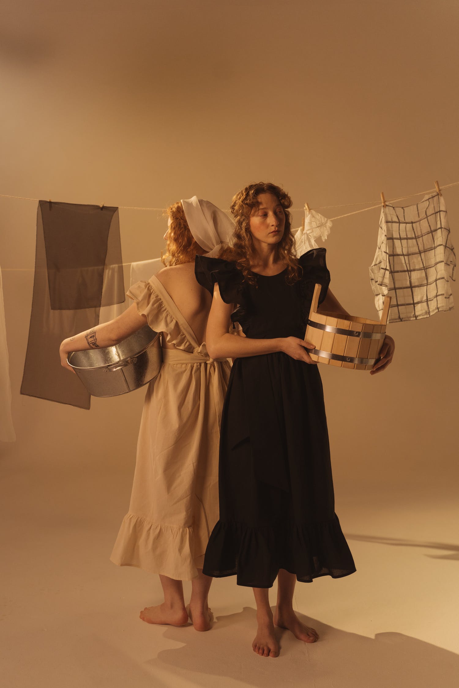 women standing near the clothesline